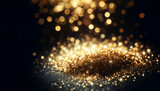 golden glitter sparkling on a dark background,