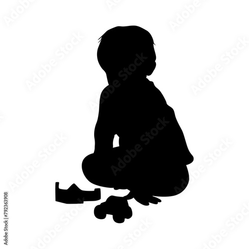 Kid playing with toys, Little boy playing block toys in home at nursery. Toddler having fun silhouette