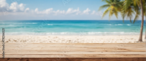.Empty wooden deck overlooking a blurred tropical beach paradise with palm leaves and turquoise sea.