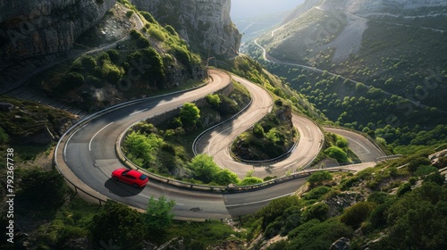 A car maneuvering through hairpin turns on a mountain road, with sweeping views below