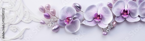 Luxurious silver earrings with delicate stones and soft purple orchids, displayed on a plush velvet surface for an elegant presentation