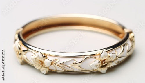 Luxurious presentation of a silver bangle with soft white lily motifs, arranged on a plush white velvet surface for a sophisticated effect
