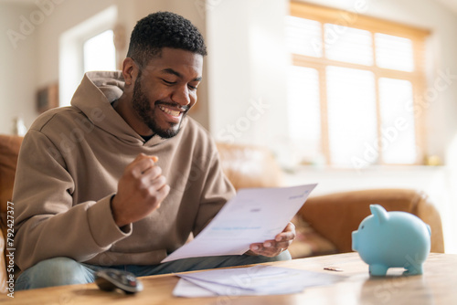 happy man reading letter response to his job application loan mortgage Happy smiling excited
