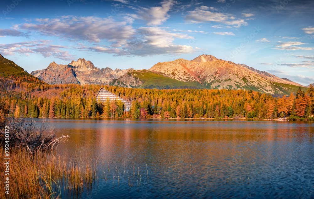 Colorful autumn view of Strbske pleso lake. Majestic morning scene of High Tatra National Park, Slovakia, Europe. Beauty of nature concept background.