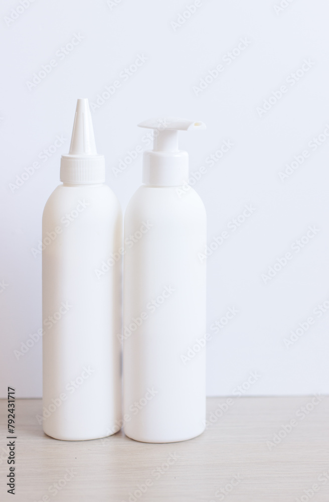 Blank templates of empty and clean white plastic bottles. Cylindrical round bottles with screw cap, flip top, mock-up cosmetic blank package. - obrazy, fototapety, plakaty 