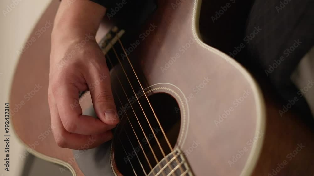 man playing at the classic guitar, close up hand and musical instrument.singer in restaurant live music show.moody atmosphere, night time man playing at the classic guitar, close up hand and musical instrument.singer in restaurant live music show.moody atmosphere, night time