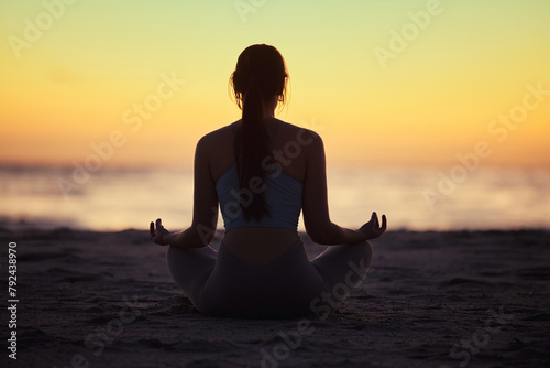 Silhouette, lotus and woman at beach for yoga exercise, meditation or mindfulness in summer at sunset. Back, padmasana and girl at ocean for balance, spiritual peace and calm on mockup space at sea