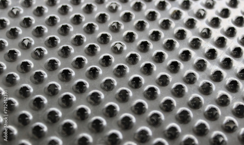 Foto Jagged Edges Of Holes On Steel Puree Grater Surface Textured Background