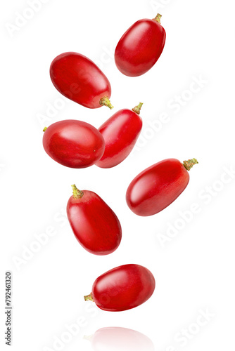 red grape falling on white