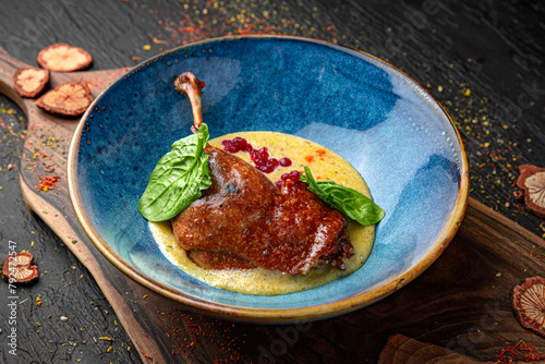 Duck Confit - French slow roasted duck legs. Menu for a pub on a dark background. Colorful juicy food photography.