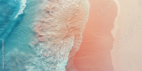 A breathtaking aerial view captures the sandy expanse of a beach, where light blue transparent waves gently kiss the shore under the warm glow of the sun.