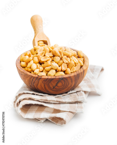 Salted roasted peanuts in bowl isolated on white background.