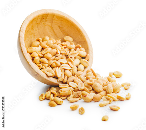 Salted roasted peanuts in bowl isolated on white background.