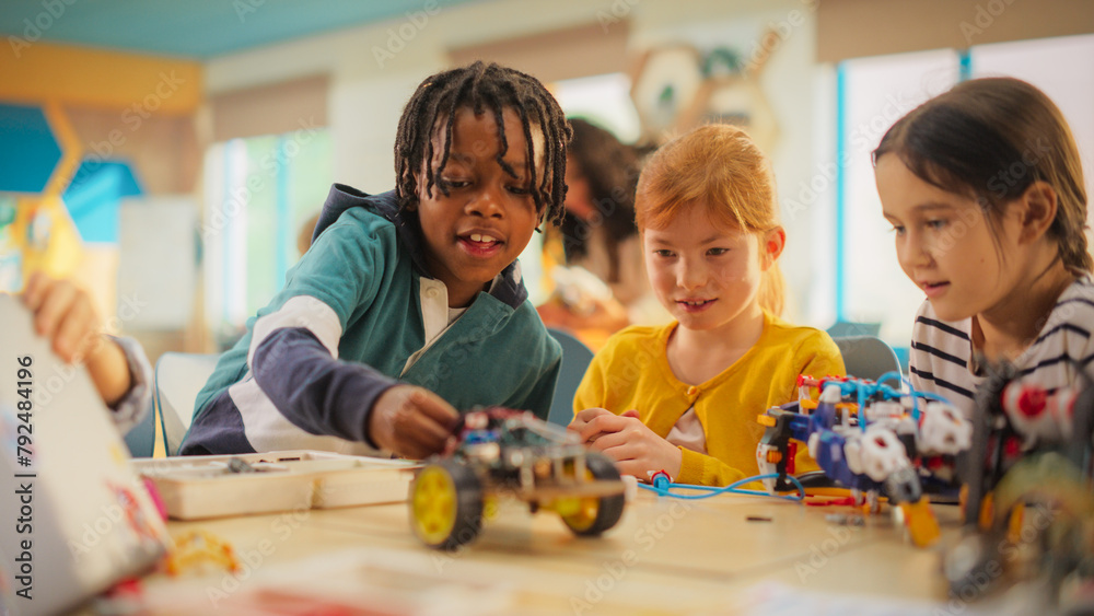 Obraz premium Smart Boys and Talented Girls Playing with Scientific and Engineering Toys. Young Gifted Future Engineers Studying Science, Engineering, Math and Technology in Primary STEM School