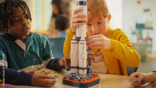 Smart Boys and Talented Girls Making a Model of a Modern Multiplanetary Space Rocket. Young Gifted Future Engineers Studying Science, Engineering, Space and Technology in Primary STEM School