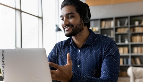 Happy Indian call center agent wearing headset talking to client working in customer support , generated by AI
