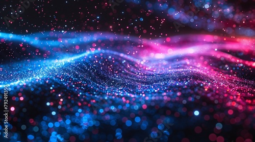 Blue and pink glitter particles form waves against a black background, represent data stream photo