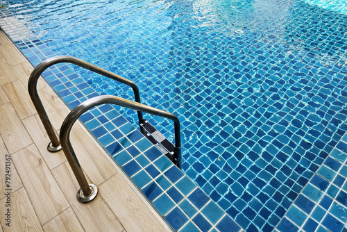 Stainless steel swimming pool ladder.