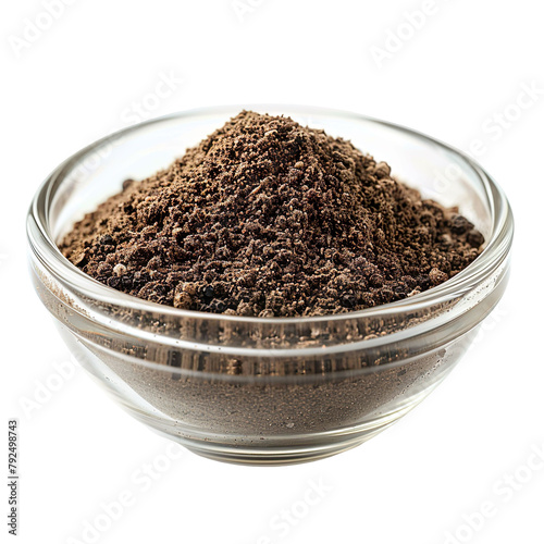 Extreme Front view of powdered Black Pepper in a small glass bowl isolated on a white transparent background