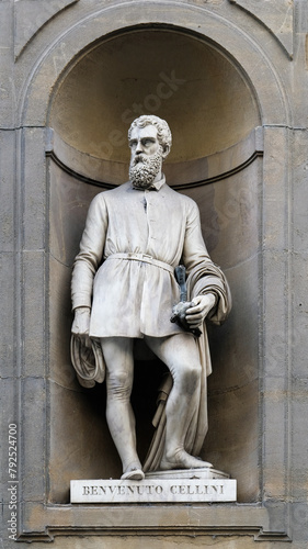 FLORENCE, ITALY-May 30,2023: Statue of Benvenuto Cellini in the niches of the Uffizi Gallery colonnade, Florence, Italy. photo