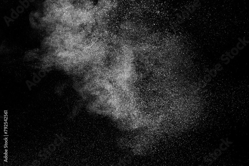 White dust powder particles cloud on black background