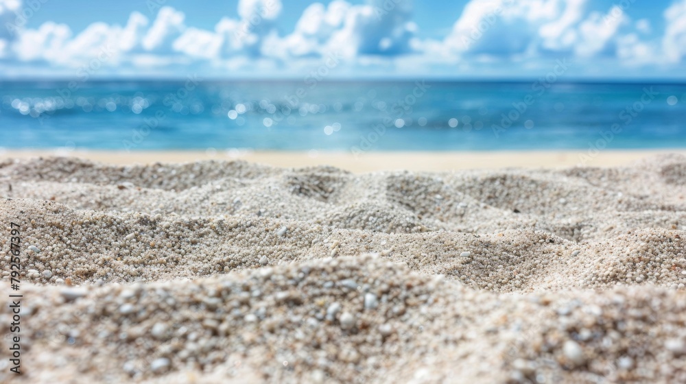 Close-up of sandy beach texture with blurred sea background - natural scenery, tranquil environment, coastal design Close-up of sandy beach texture with blurred sea background - natural scenery, tranquil environment, coastal design