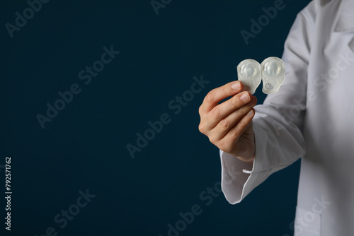 A container for contact lenses in the hand of a doctor photo