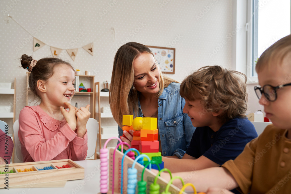 Teacher and children doing sensory exercises in the kindergarten Teacher and children doing sensory exercises in the kindergarten