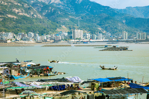 Lianjiang County, Fuzhou City, Fujian Province - Scenery of the bay fishing port against the blue sky photo