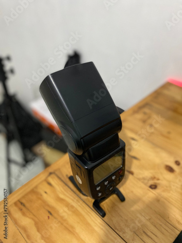 Camera flash equipment is displayed on the table