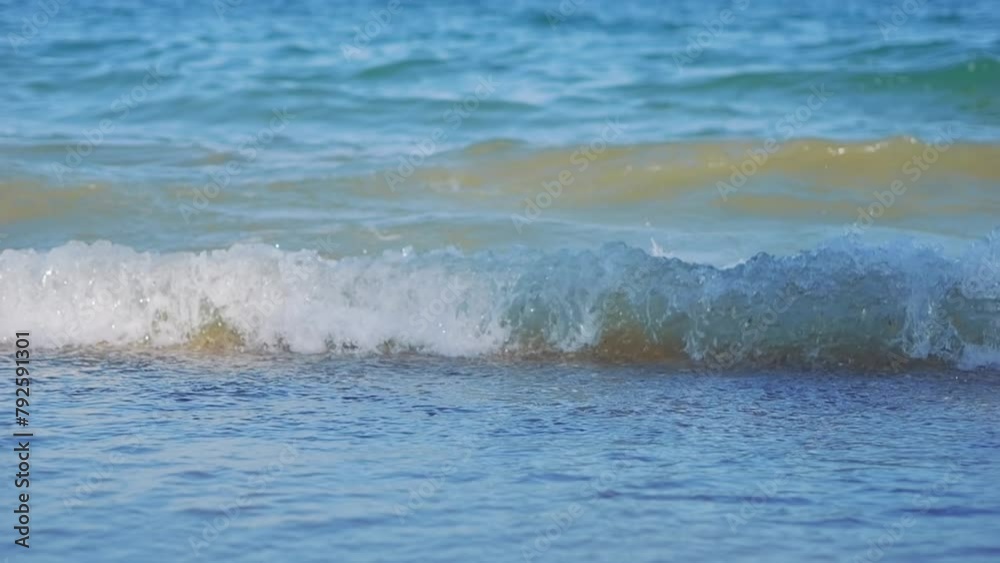 Waves gently rolling onto the sandy beach in slow motion in slow motion 300fps Waves gently rolling onto the sandy beach in slow motion in slow motion 300fps