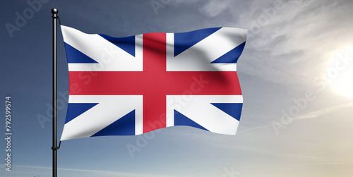United Kingdom. national flag cloth fabric waving on beautiful grey sky Background.