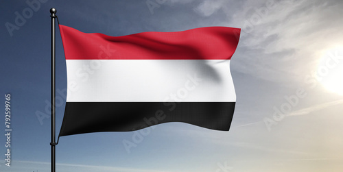 Yemen national flag cloth fabric waving on beautiful grey sky Background.