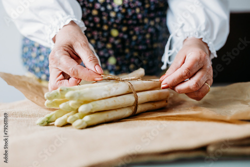 Close up of elderly woman's hands with asparagus © JRP Studio