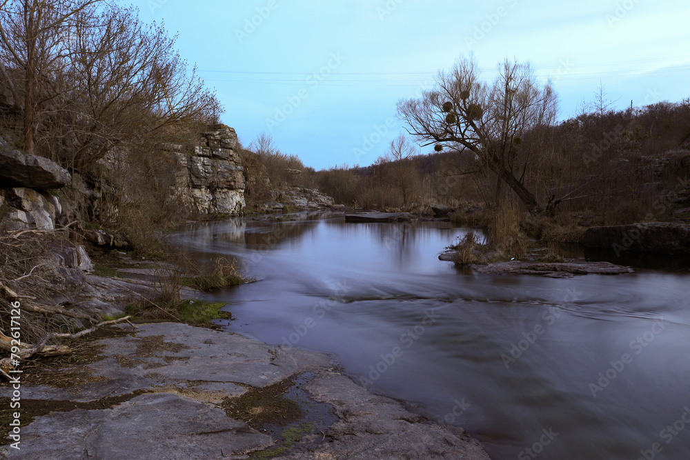 Mountain river flowing through the rocks in the evening Mountain river flowing through the rocks in the evening