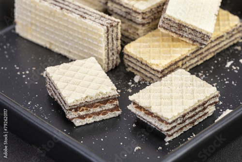 Cracked chocolate filled wafers, wafer bar slices, long cut biscuit sticks .