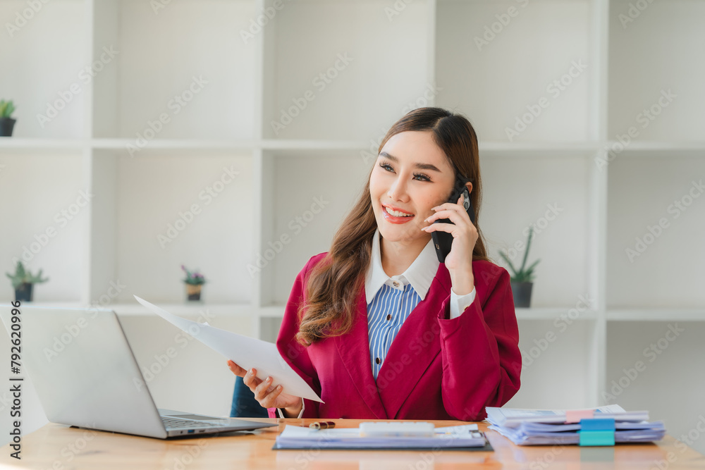 Professional business woman having a phone call with her coworker about the current project. Professional business woman having a phone call with her coworker about the current project.