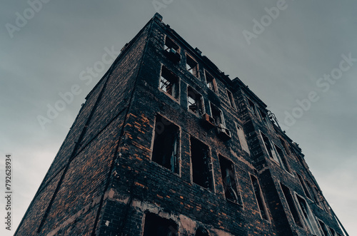 destroyed and burned houses in the city Russia Ukraine war photo