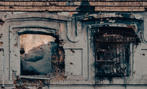 empty windows of a damaged house in Ukraine photo