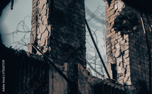 empty windows of a damaged house in Ukraine photo