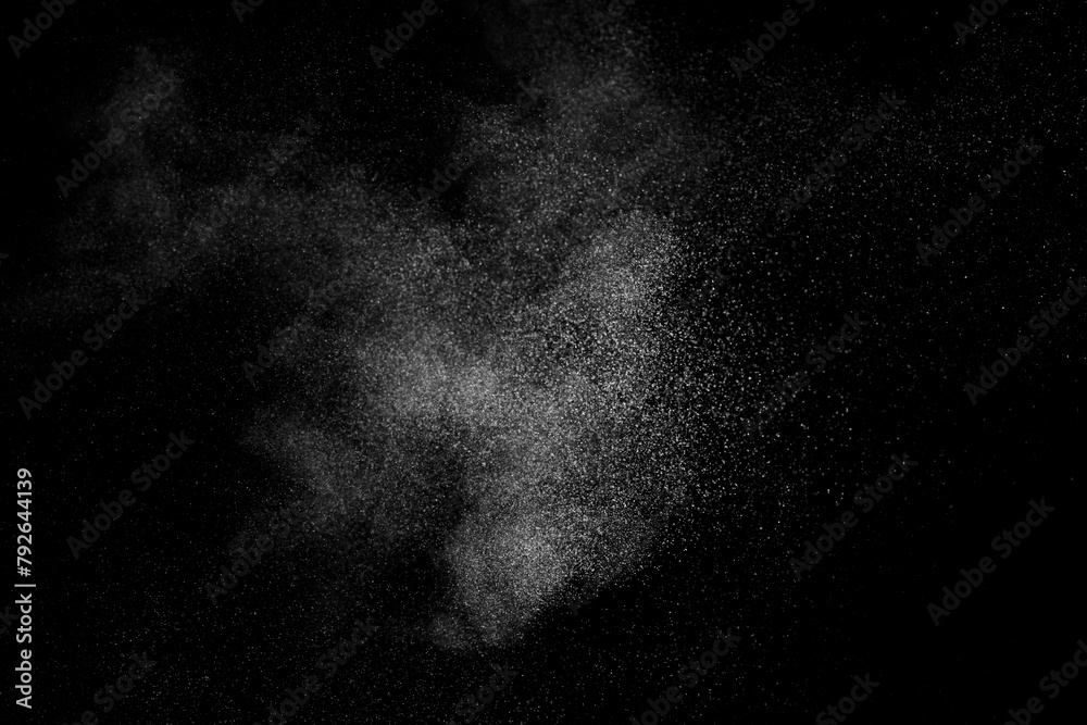 Naklejka premium White texture on black background. Dark textured pattern. Abstract dust overlay. Light powder explosion. 