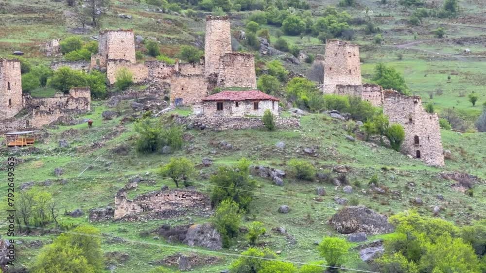 The complex of old Egikal Towers, the largest medieval castle-type tower villages, is located on the outskirts of a mountain range in Ingushetia, Russia. An ancient family crypt. 4К The complex of old Egikal Towers, the largest medieval castle-type tower villages, is located on the outskirts of a mountain range in Ingushetia, Russia. An ancient family crypt. 4К
