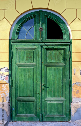 old green door of the historic Villa Mary in the spa town of Bath Voeslau, Austria