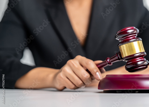 Blurred woman holding judge gavel