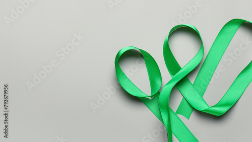 green ribbons on light gray background. World Health day concept background. Generative AI photo