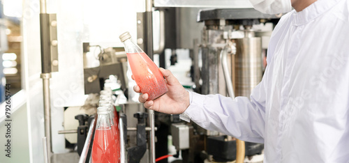 quality inspector food or beverages technician inspection about quality control food or beverages before send product to the customer. Production leader recheck ingredient and productivity. photo