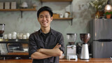 The Southeast Asian owner of the small coffee shop business smiled and crossed his arms