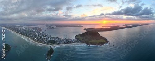 Panorama of a Sunset over the horizon in Mount Maunganui, New Zealand photo