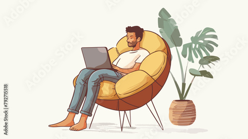 Young man is relaxing on comfortable chair and using photo