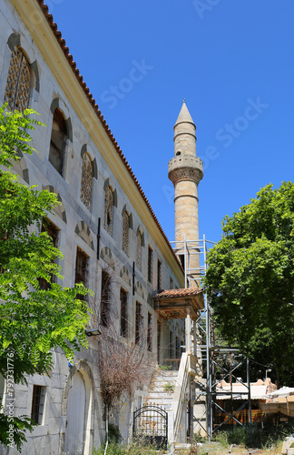 Abandoned Ottoman Mosque with Trees and Blue Sky Background